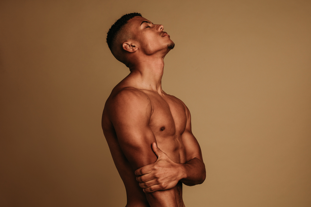 African,American,Muscular,Man,Standing,On,Brown,Background.,Fit,Man 018b606b08034f6f812130765732293e