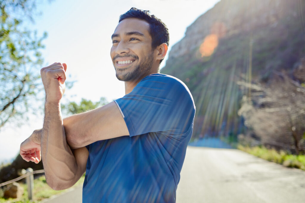 Man stretching after receiving muscle recovery blend IV therapy in Jacksonville