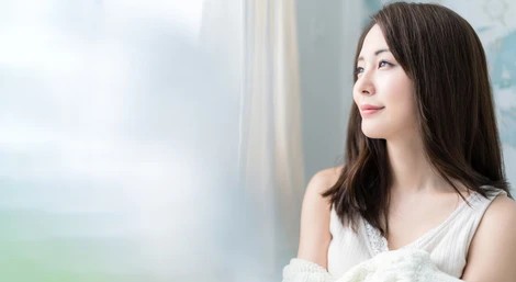 A woman looking out a window
